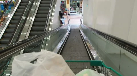 Riding down escalator in supermarket.60 fps. Stock Footage 49131202