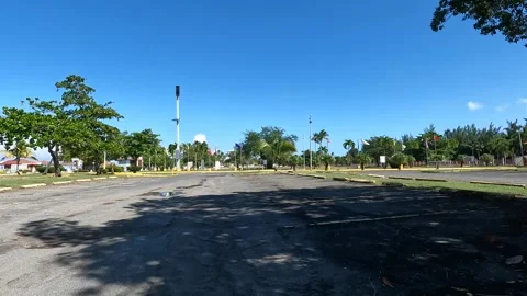 Riding, driving, biking in empty parking lot at beach (carolina, puerto rico) Stock Footage 279001155