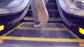 RIDING UP AN ESCALATOR Stock Footage 86083711