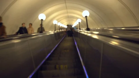 Riding Escalator in Subway. Defocused Stock Footage 76345266