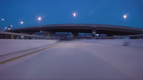 Riding up Interstate Ramp Clock Magic Hour Video stock 69744022