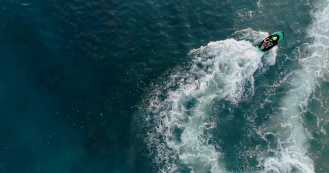 Riding a jet ski Stock Footage 129610398
