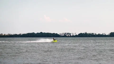 Riding a jet ski in slow motion Stock Footage 207819917