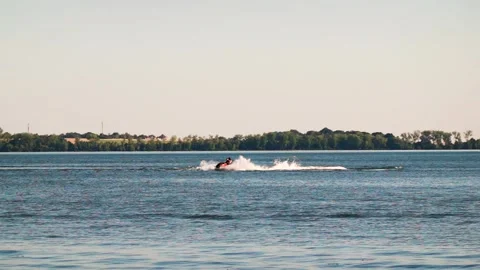 Riding a jet ski in slow motion Video stock 207819922