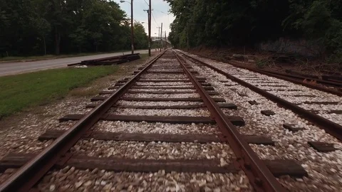 Riding low along train track Видео 70416284
