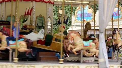 Riding a merry go round Stock Footage 78487164