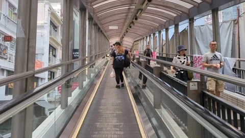 Riding the Mid Level escalator in Hong Kong Central Stock Footage 271192047