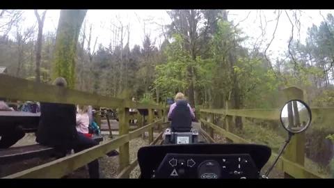 Riding a Mobility Scooter down to Derwent Dam, Peak District. 16th June 2024 Stock Footage 284560348