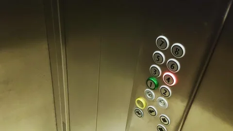 Riding in a modern freight elevator with the floor button pressed, industry Stock Footage 297255804