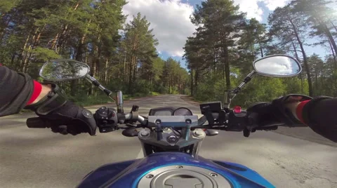 Riding a motorcycle on forest road Stock Footage 46703088