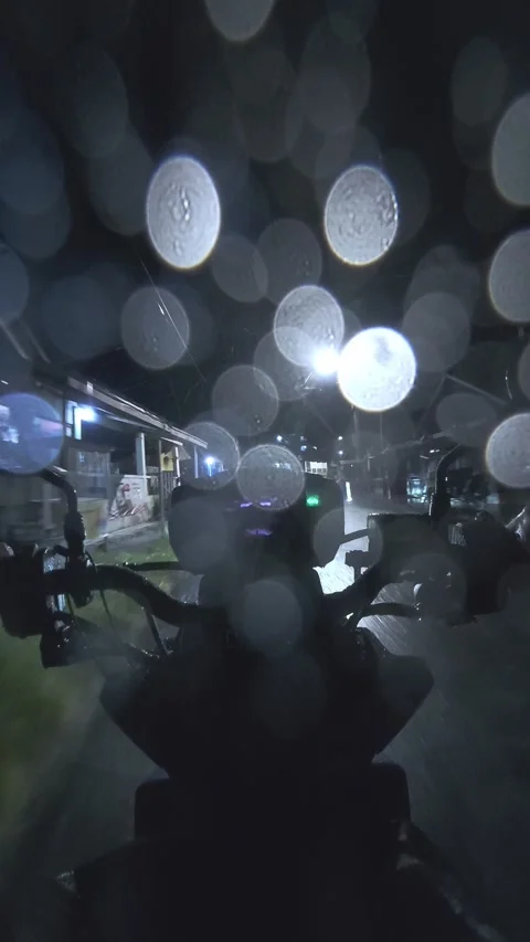 Riding Motorcycle in Rain at Night Stock Footage 340334590