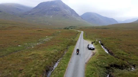 Riding motorcycle in a valley Video stock 139817905