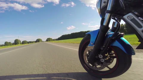 Riding a motorcycle, view on front wheel Stock Footage 46703069