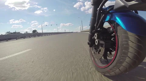 Riding a motorcycle, view on front wheel Stock Footage 46703163