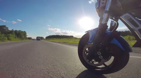 Riding a motorcycle, view on front wheel Stock Footage 46703201