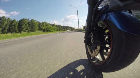 Riding a motorcycle, view on front wheel Video stock 46703239