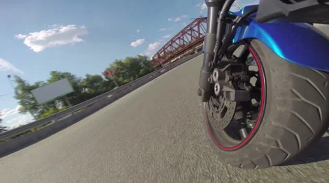 Riding a motorcycle, view on front wheel Stock Footage 46703287
