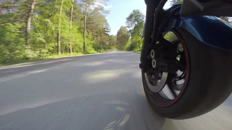 Riding a motorcycle, view on front wheel Stock Footage 46703396