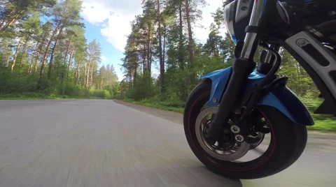 Riding a motorcycle, view on front wheel Stock Footage 46703476