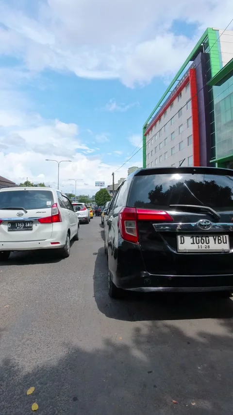 Riding a motorcycle, weaving through the queue of cars Stock Footage 329394413