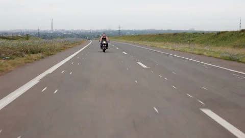 Riding a motorcycle without a helmet Stock Footage 96257854