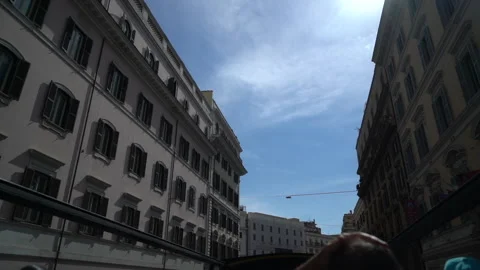 Riding an open air double decker tour bus in Roma, Italy. Old european street Stock Footage 214297800
