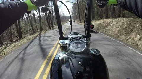 Riding  with other bikers following and passing. Stock Footage
