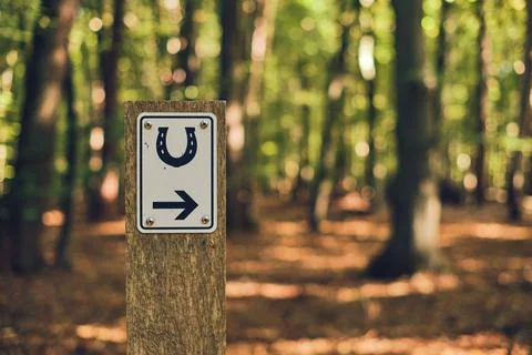 Riding path sign with arrow Stock Photos