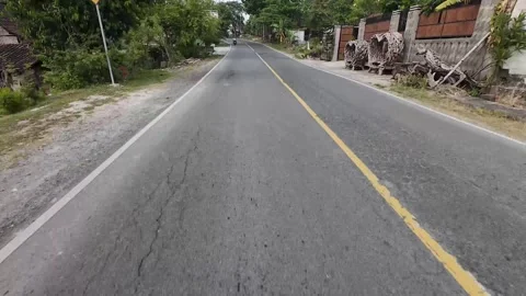 Riding pov passing through the forest in Central Java, Indonesia Stock Footage 316877311