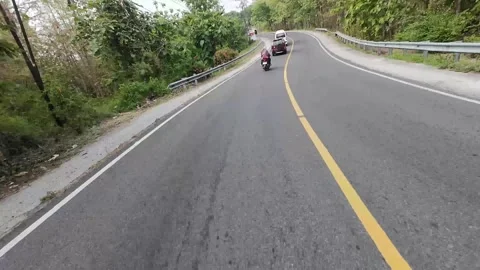 Riding pov passing through the forest in Central Java, Indonesia Stock Footage 316877371