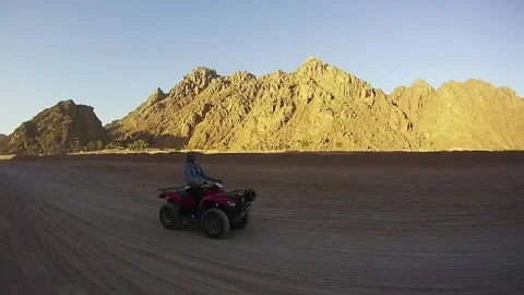 Riding on Quad Bikes in the Desert of Egypt Stock Footage 272267317