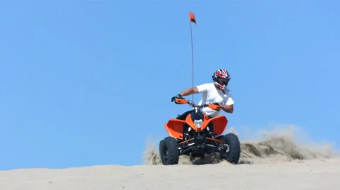 Riding quad in sand, slow motion Stock Footage 62280495