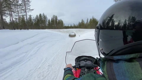 Riding a red snowmobile in winter through a tunnel at the arctic circle 스톡 동영상 149395740