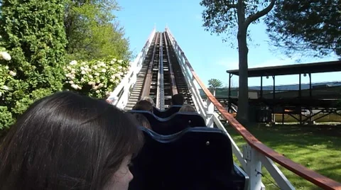 Riding Rollercoaster to Top of Hill Stock Footage 8652495