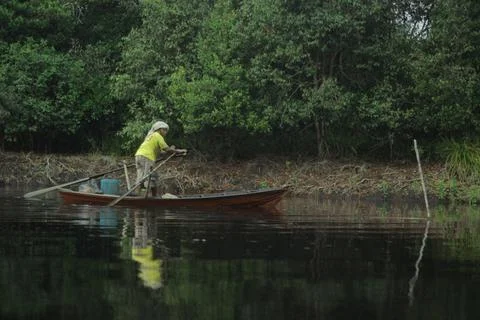 Riding a rowboat Stock Photos