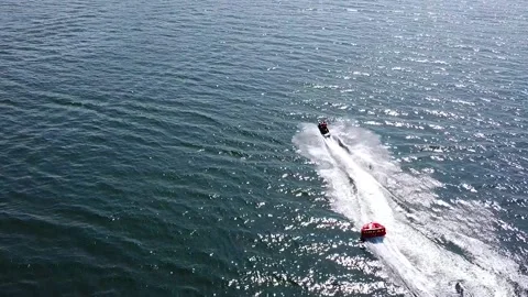 Riding on a rubber inflatable sofa in the sea Stock Footage 178372791