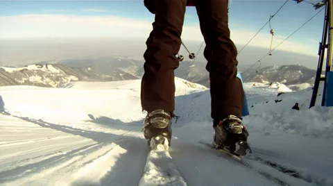Riding a ski lift Видео 33302376