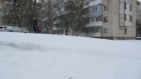 Riding on a snow slide. Slow motion 01.10.2020 Ukraine, Kiev Stock Footage 126629933