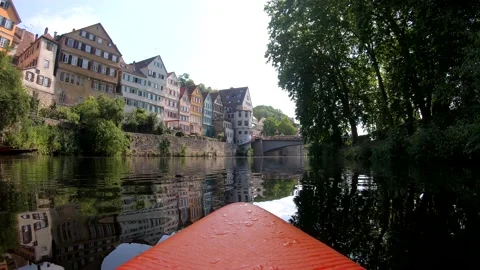 Riding a stand up paddle board (SUP) down the Neckar river in Tuebingen Stock Footage 134462299