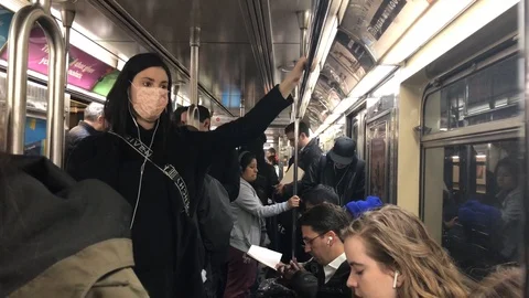 Riding in the subway in a face mask Stock Footage 124224965