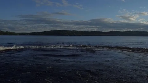 Riding into the sunset on a jet ski in slow motion Stock Footage 78766181