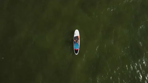 Riding on the sup board 1 Stock Footage 160264891