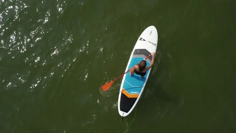 Riding on the sup board 2 Stock Footage 160264900