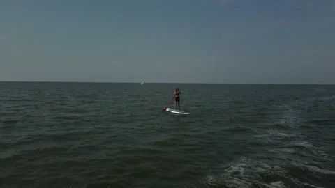 Riding on the sup board 3 Stock Footage 160264909