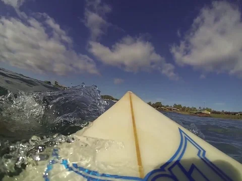 Riding surfboard Stock Footage 77047089