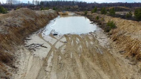 Riding on the SUV through a puddle Stock Footage 128988866