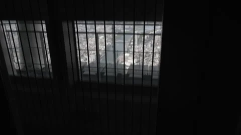 Riding up on the Tokyo Skytree elevator over city scape Stock Footage 242423305