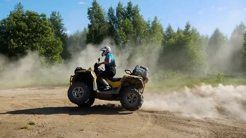 Riding two wheels on an ATV Stock Footage 93284724