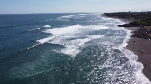 Riding the Waves - Aerial Flight Over Munggu's Thrilling Ocean Swells Stock Footage 248212576