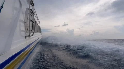 Riding the Waves: Fast Boat Hull Breaking Through Swells Stock Footage 237554925